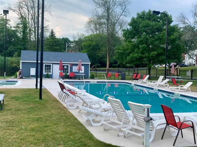 1 Olde Wagon Rd, Warwick, NY 10990 - community pool featuring an outdoor structure, a patio, view of scattered trees, and an exterior structure