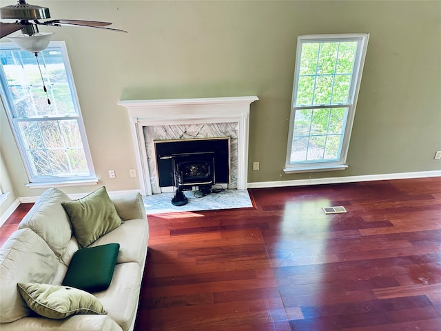 1 Olde Wagon Rd, Warwick, NY 10990 - living area featuring wood finished floors, healthy amount of natural light, and a wood stove