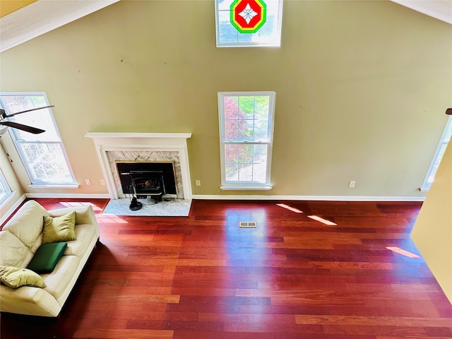 1 Olde Wagon Rd, Warwick, NY 10990 - living room featuring a wood stove, high vaulted ceiling, wood finished floors, a ceiling fan, and baseboards