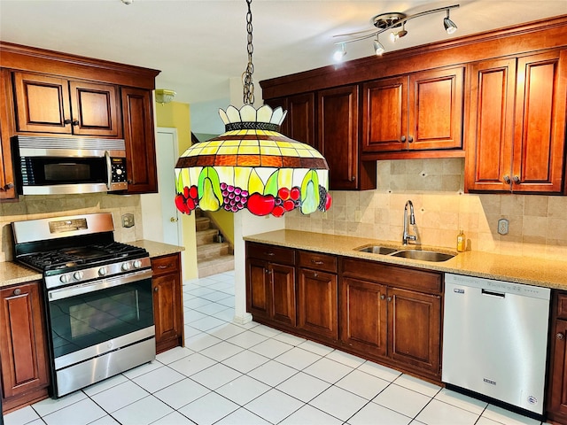 1 Olde Wagon Rd, Warwick, NY 10990 - kitchen with stainless steel appliances, a sink, decorative backsplash, and light tile patterned floors