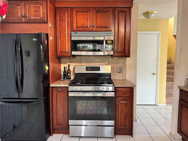 1 Olde Wagon Rd, Warwick, NY 10990 - kitchen featuring stainless steel appliances, backsplash, light tile patterned floors, and light stone countertops