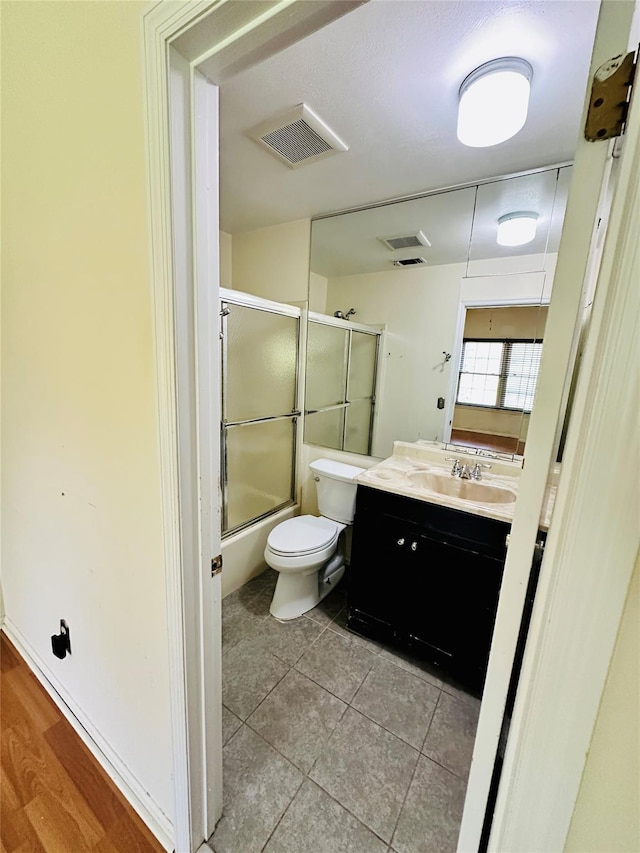 1 Olde Wagon Rd, Warwick, NY 10990 - bathroom with vanity, toilet, combined bath / shower with glass door, and tile patterned floors