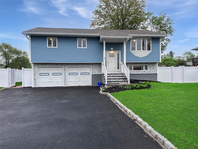 42 Blacker St, Brentwood, NY 11717 - bi-level home featuring a garage and driveway