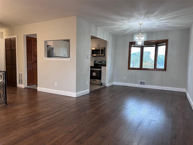 42 Blacker St, Brentwood, NY 11717 - unfurnished living room featuring a chandelier, dark wood-type flooring, and baseboards