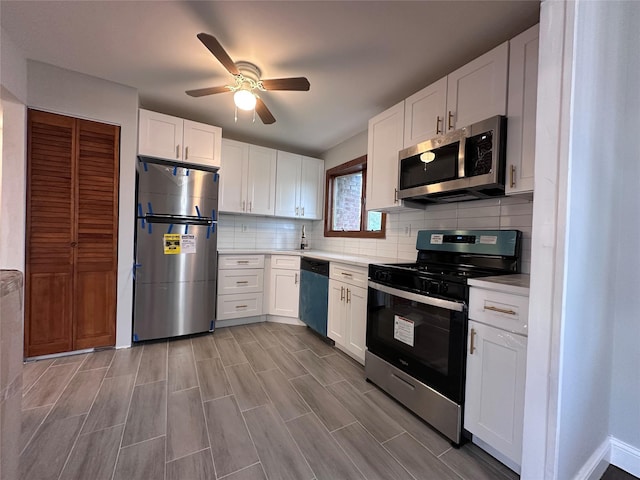 42 Blacker St, Brentwood, NY 11717 - kitchen with stainless steel appliances, ceiling fan, light countertops, white cabinets, and decorative backsplash