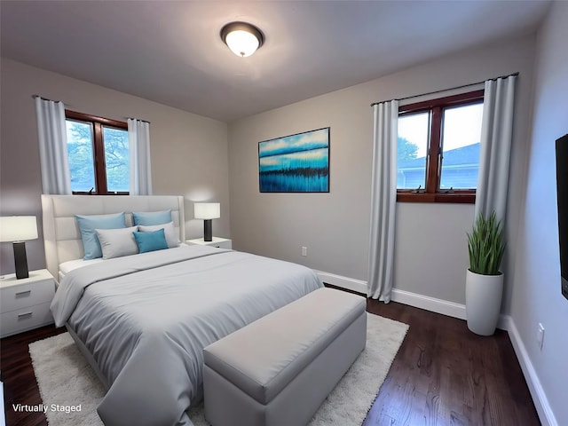 42 Blacker St, Brentwood, NY 11717 - bedroom with baseboards and dark wood-style floors