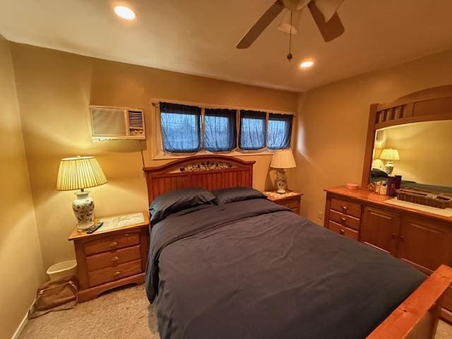 bedroom with light carpet, a ceiling fan, recessed lighting, and an AC wall unit