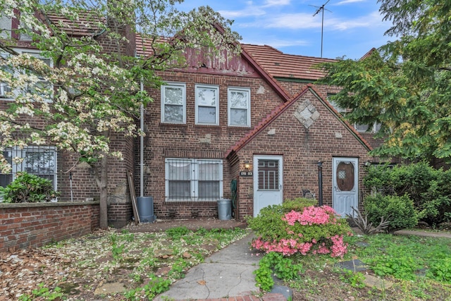 179-03 Selover Rd, Jamaica, NY 11434 - tudor home featuring brick siding and a tile roof