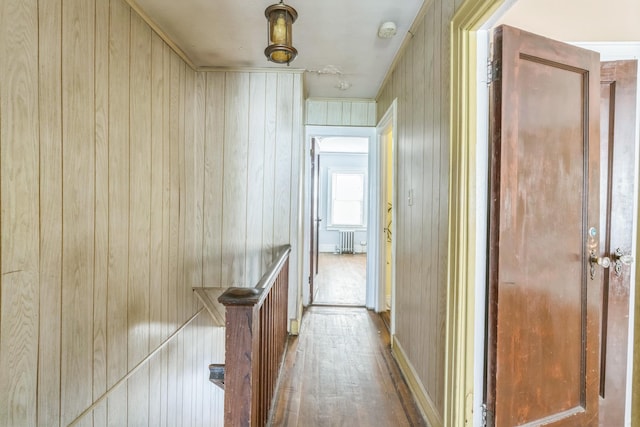 179-03 Selover Rd, Jamaica, NY 11434 - hall with radiator heating unit, wood finished floors, and wooden walls