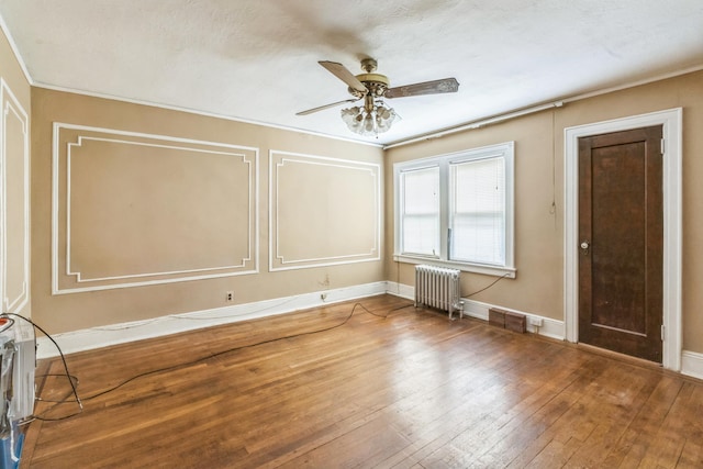179-03 Selover Rd, Jamaica, NY 11434 - empty room with radiator, a ceiling fan, ornamental molding, hardwood / wood-style floors, and baseboards
