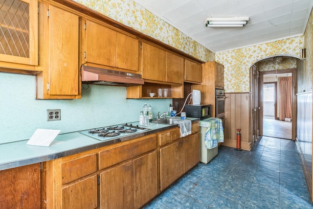 179-03 Selover Rd, Jamaica, NY 11434 - kitchen featuring wallpapered walls, under cabinet range hood, oven, a sink, and brown cabinets