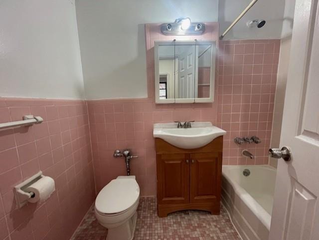 108-49 63rd Dr Unit 1K, Forest Hills, NY 11375 - bathroom featuring tile walls, vanity, tile patterned flooring, bathtub / shower combination, and wainscoting