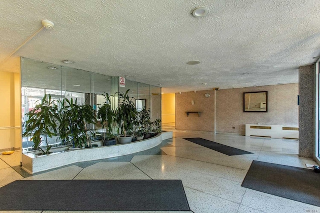 108-49 63rd Dr Unit 1K, Forest Hills, NY 11375 - lobby with a textured ceiling