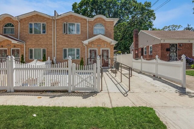 23118 145th Ave, Springfield Gardens, NY 11413 - view of front of property featuring brick siding and a fenced front yard