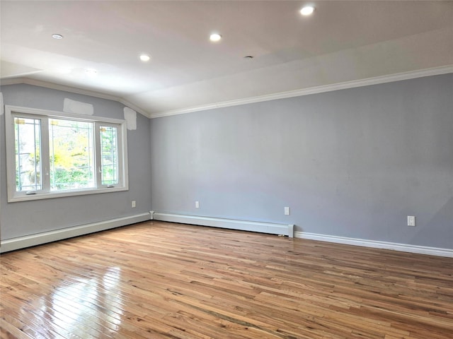23118 145th Ave, Springfield Gardens, NY 11413 - spare room featuring lofted ceiling, crown molding, wood-type flooring, a baseboard heating unit, and baseboards
