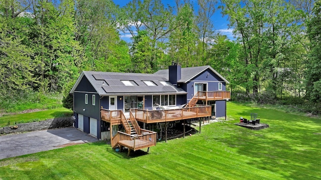 6 Edgewater Rd, Poughkeepsie, NY 12603 - rear view of property with stairway, driveway, a garage, and a yard