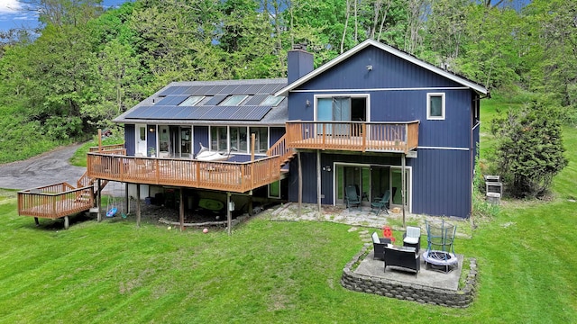 6 Edgewater Rd, Poughkeepsie, NY 12603 - back of house featuring a fire pit, a deck, a patio area, and a chimney
