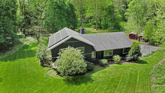 6 Edgewater Rd, Poughkeepsie, NY 12603 - view of front of home featuring a front lawn, a chimney, a shingled roof, and solar panels