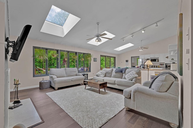 6 Edgewater Rd, Poughkeepsie, NY 12603 - living room with a skylight, a ceiling fan, baseboards, and high vaulted ceiling