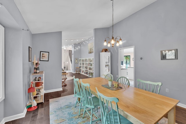 6 Edgewater Rd, Poughkeepsie, NY 12603 - dining space featuring baseboards, vaulted ceiling, wood finished floors, and a chandelier