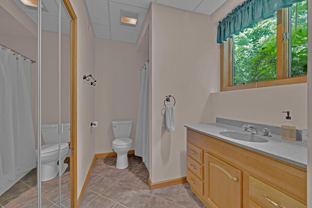 6 Edgewater Rd, Poughkeepsie, NY 12603 - bathroom featuring toilet, tile patterned flooring, vanity, a shower with shower curtain, and baseboards