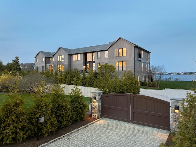 34 Westbridge Rd, Westhampton Beach, NY 11978 - view of front of property with a gate and board and batten siding