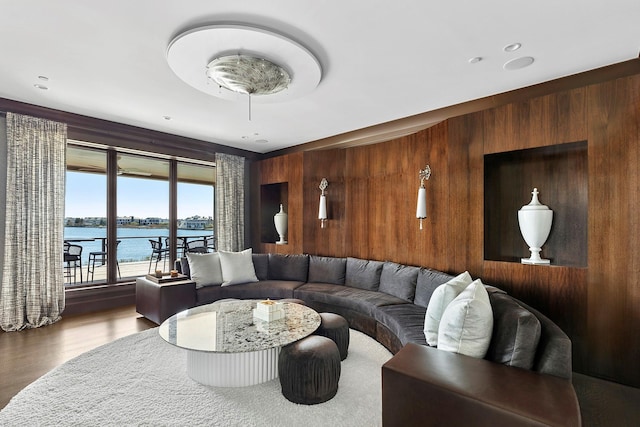 34 Westbridge Rd, Westhampton Beach, NY 11978 - living room featuring wooden walls, a water view, and wood finished floors
