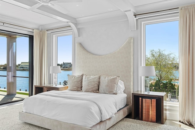34 Westbridge Rd, Westhampton Beach, NY 11978 - bedroom featuring a water view, access to exterior, beamed ceiling, and speckle patterned floor