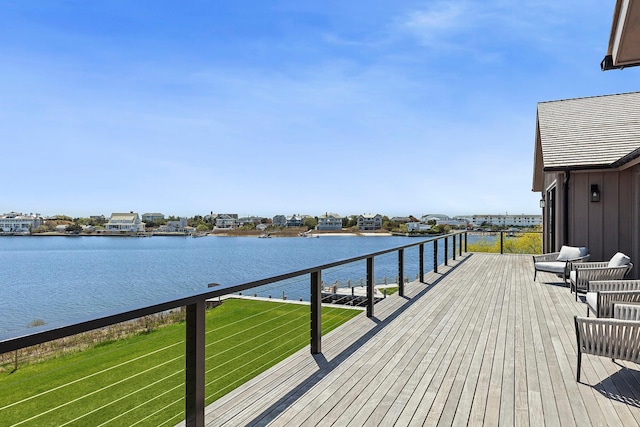 34 Westbridge Rd, Westhampton Beach, NY 11978 - wooden terrace with a water view and a lawn