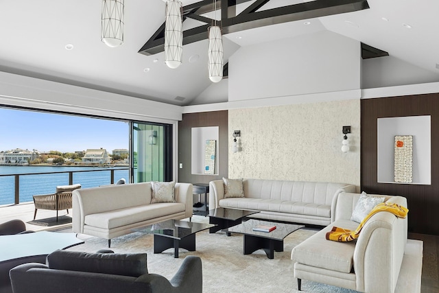 34 Westbridge Rd, Westhampton Beach, NY 11978 - living room with high vaulted ceiling, a water view, carpet, and recessed lighting