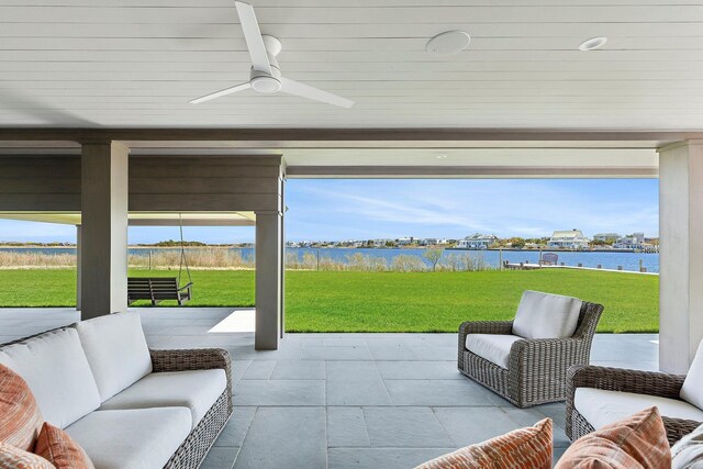 34 Westbridge Rd, Westhampton Beach, NY 11978 - sunroom featuring a water view, an outdoor hangout area, and a ceiling fan