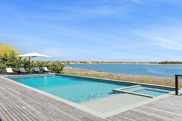 34 Westbridge Rd, Westhampton Beach, NY 11978 - view of pool with a water view, a pool with connected hot tub, and a patio