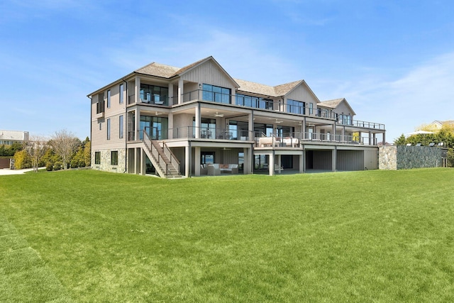 34 Westbridge Rd, Westhampton Beach, NY 11978 - rear view of property with a balcony, a yard, and stairway