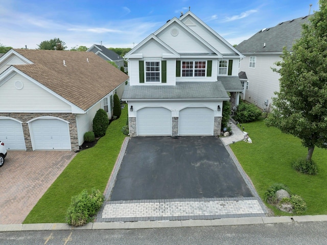7 Marisa Dr, Middle Island, NY 11953 - traditional-style home with asphalt driveway, stone siding, and a front lawn