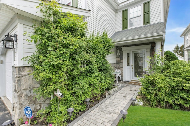 7 Marisa Dr, Middle Island, NY 11953 - entrance to property with stone siding, a garage, and a lawn