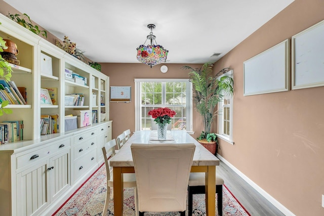 7 Marisa Dr, Middle Island, NY 11953 - dining space with light wood-style flooring and baseboards