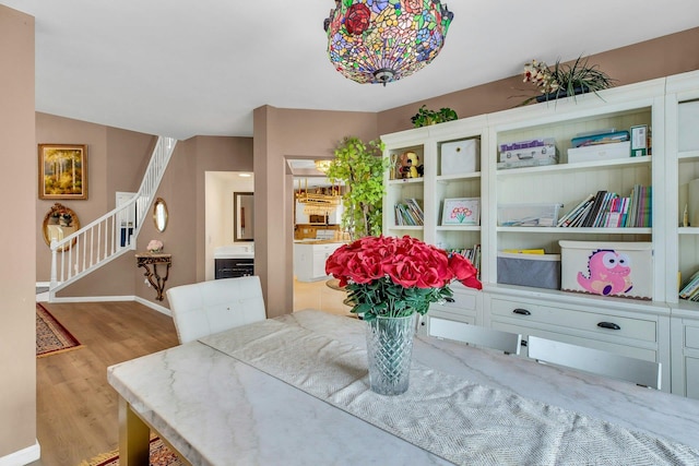 7 Marisa Dr, Middle Island, NY 11953 - dining area featuring stairway, wood finished floors, and baseboards