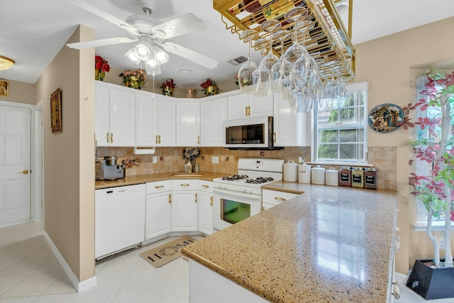7 Marisa Dr, Middle Island, NY 11953 - kitchen featuring white appliances, ceiling fan, white cabinetry, backsplash, and a peninsula