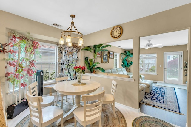 7 Marisa Dr, Middle Island, NY 11953 - dining room featuring a chandelier, baseboards, and ceiling fan
