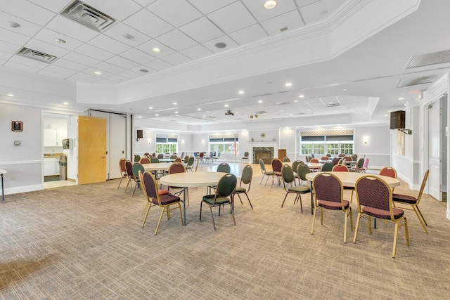7 Marisa Dr, Middle Island, NY 11953 - dining space featuring crown molding, a raised ceiling, light carpet, recessed lighting, and healthy amount of natural light