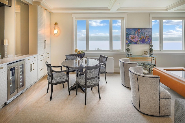 16 Rockledge Ave Unit 5D-2, Ossining, NY 10562 - dining space with wine cooler, plenty of natural light, light wood finished floors, ornamental molding, and baseboards
