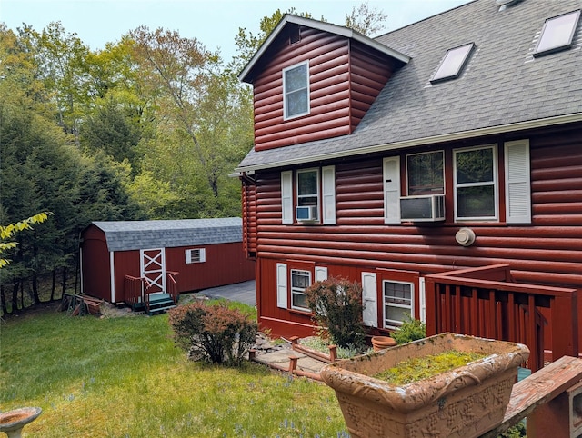 11 W Mongaup Trl, Smallwood, NY 12778 - view of property exterior with a shingled roof, a lawn, faux log siding, and cooling unit
