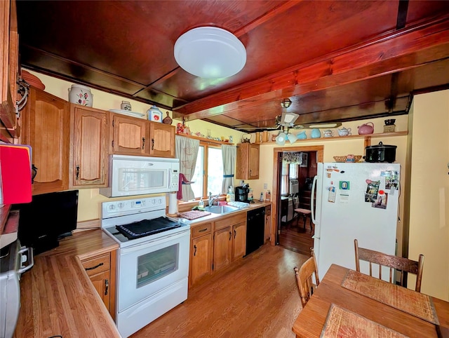11 W Mongaup Trl, Smallwood, NY 12778 - kitchen featuring white appliances, light wood finished floors, light countertops, a sink, and beamed ceiling