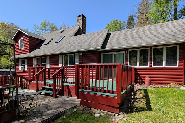 11 W Mongaup Trl, Smallwood, NY 12778 - back of property featuring a shingled roof, a wooden deck, a chimney, faux log siding, and a yard