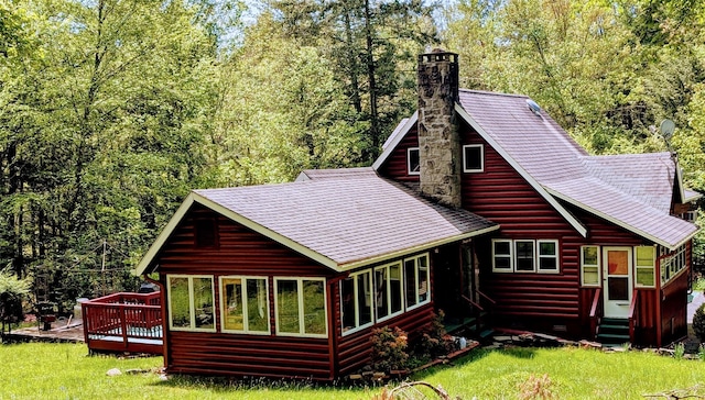 11 W Mongaup Trl, Smallwood, NY 12778 - back of property featuring a chimney, roof with shingles, a lawn, a deck, and log veneer siding