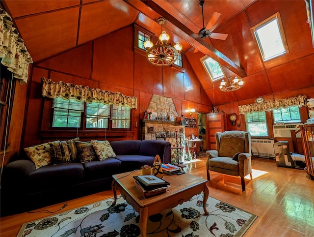 11 W Mongaup Trl, Smallwood, NY 12778 - living area with radiator heating unit, a chandelier, wood finished floors, a skylight, and high vaulted ceiling