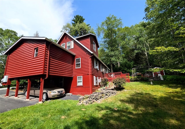 11 W Mongaup Trl, Smallwood, NY 12778 - view of home's exterior with a yard, asphalt driveway, and a carport