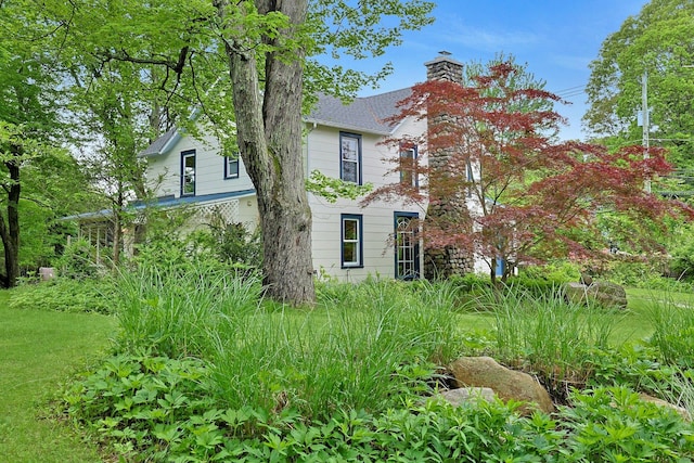 2 Amber Ridge Rd, Chestnut Ridge, NY 10977 - view of home's exterior with a chimney