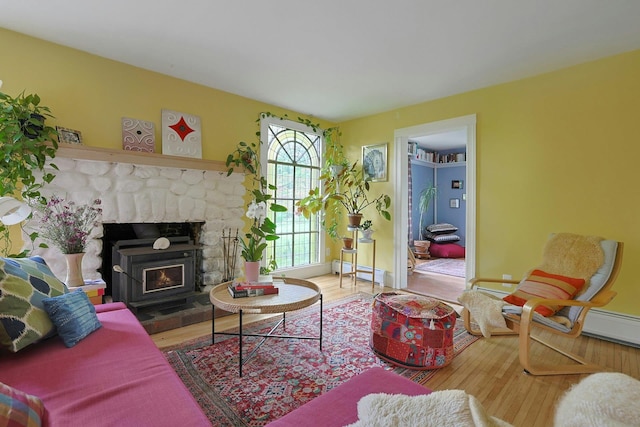 2 Amber Ridge Rd, Chestnut Ridge, NY 10977 - living area with a baseboard radiator, wood finished floors, a fireplace, and baseboards