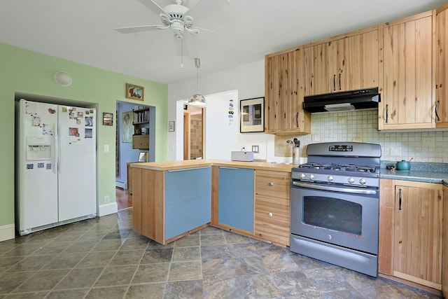 2 Amber Ridge Rd, Chestnut Ridge, NY 10977 - kitchen featuring white refrigerator with ice dispenser, gas stove, under cabinet range hood, a peninsula, and decorative backsplash